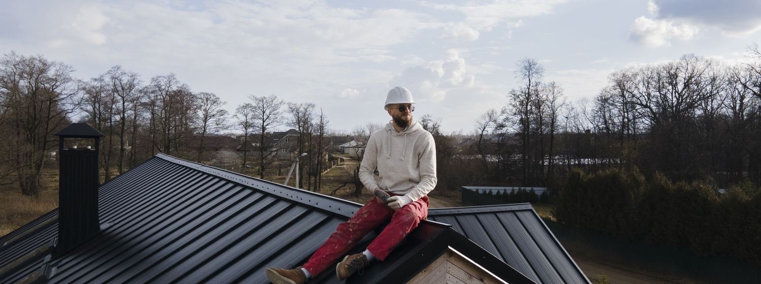 Contractor taking in the view from a finished roof