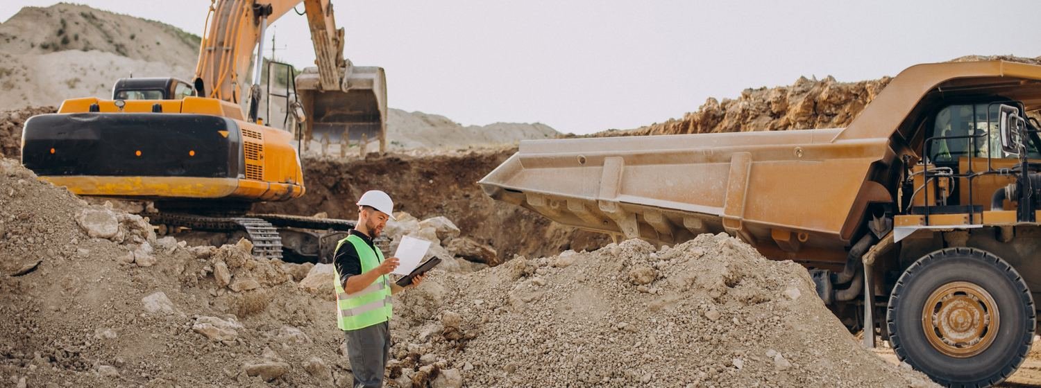 Estimator reviewing project documents on site