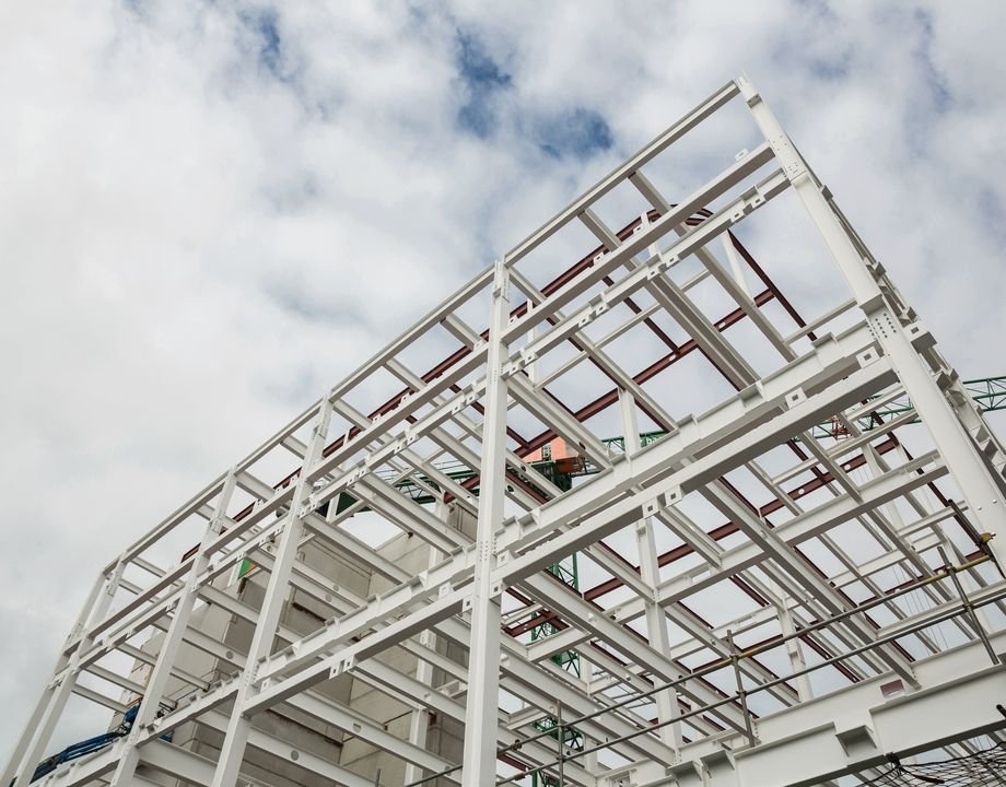 Structural steel frame rising against the sky