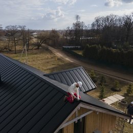 Crew coordinating work on a rooftop job site